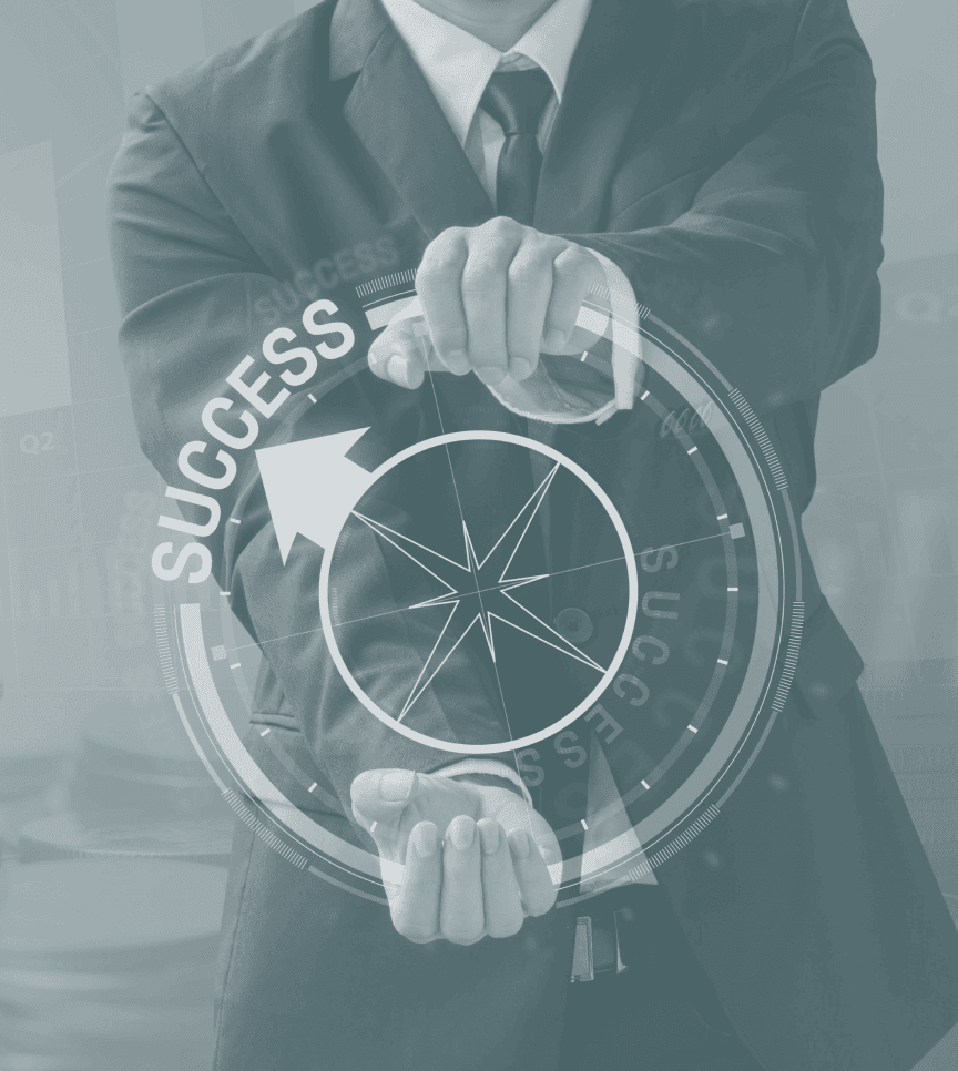 Man in suit holding a steering wheel that says "Drive Success Today"